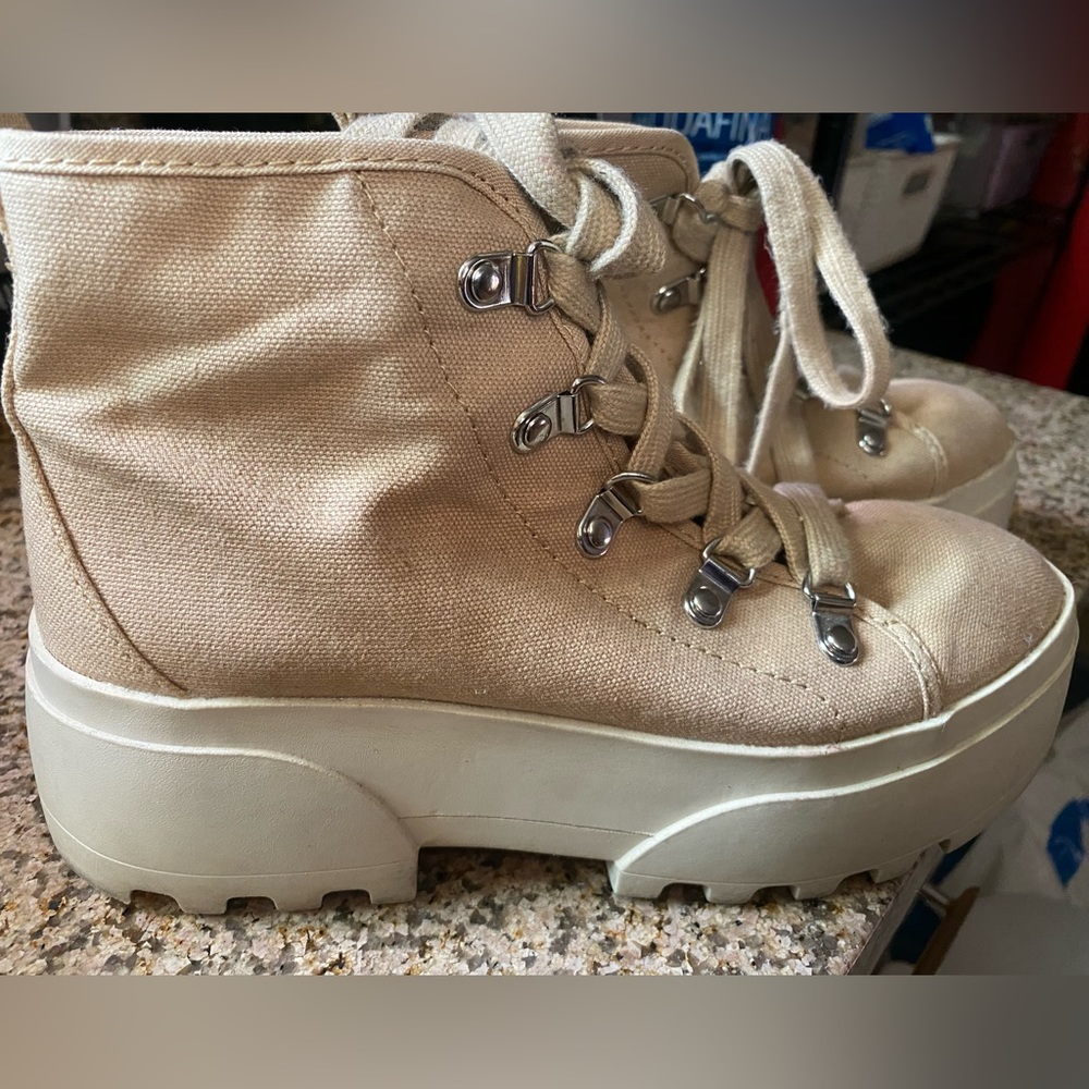 Beige chunky sneakers.